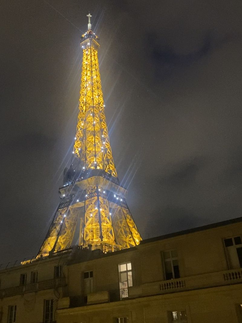 Eiffel Tower lit up gold at night