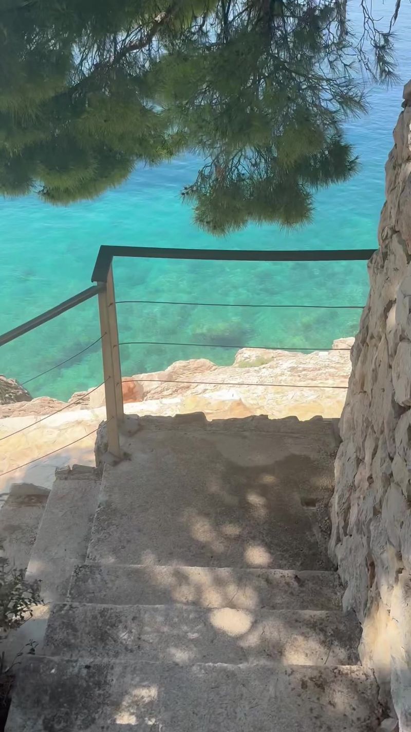 Steps down to turquoise water in Croatia